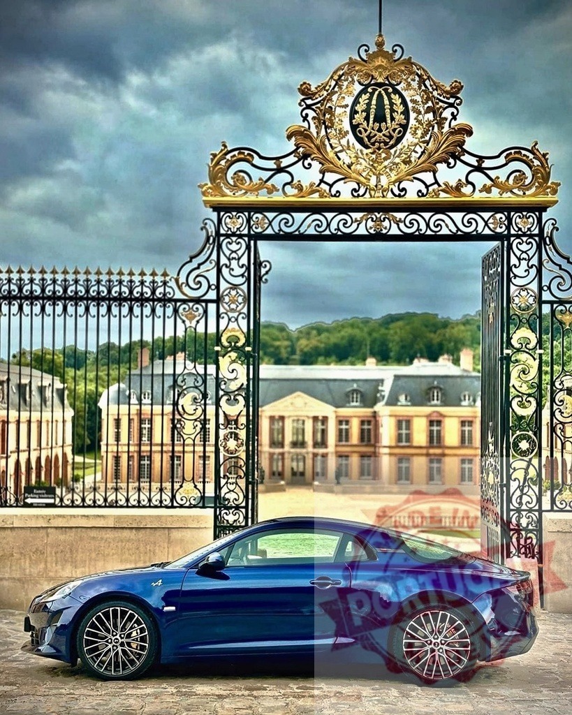 Alpine A110 sports car entering luxurious French estate gate | Blue Alpine A110 sports car parked in front of an ornate golden gate and chateau - Realisiert mit Pictrs.com