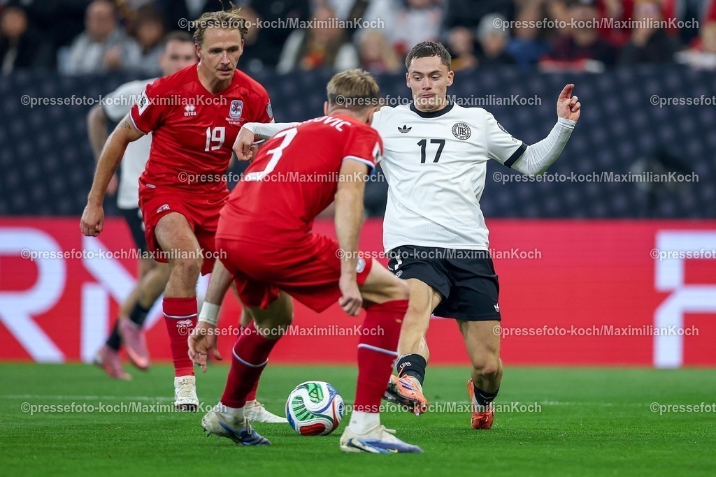 DFB10102502173 | 10.10.2025, Fußball, Länderspiel, Deutschland - Luxemburg, UEFA WM-Qualifikation, 2025/2026, Gruppe A, PreZero Arena in Sinsheim: Mathias Olesen (LUX #19) und Enes Mahmutovic (LUX #03) im Zweikampf gegen  Florian Wirtz (GER #17) DFB regulations prohibit any use of photographs as image sequences and or quasi-video.