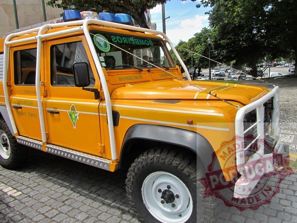 Portuguese Bombeiros volunteer firefighter truck parking on street | Volunteer firefighter truck in Santo Tirso, Portugal, parking on cobblestone street - Realized with Pictrs.com