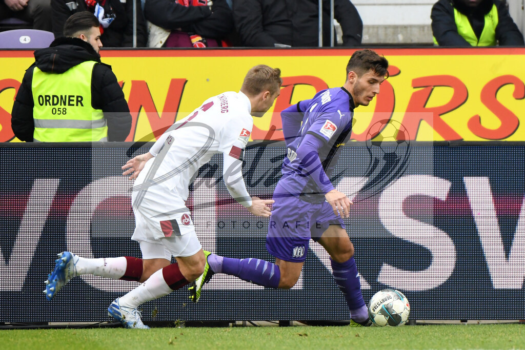 20200208_OSNFCN_0064 | Fußball, Herren: Tim Handwerker (1. FC Nuernberg) und Bashkim Ajdini (VfL Osnabrueck) im Zweikampf waehrend des Spiels der 2. Bundesliga zwischen VfL Osnabrueck und 1. FC Nuernberg im Stadion an der Bremer Bruecke am 08.02.2020 in Osnabrueck, Deutschland.DFB / DFL REGULATIONS PROHIBIT ANY USE OF PHOTOGRAPHS AS IMAGE SEQUENCES AND/OR QUASI-VIDEO. - Realisiert mit Pictrs.com