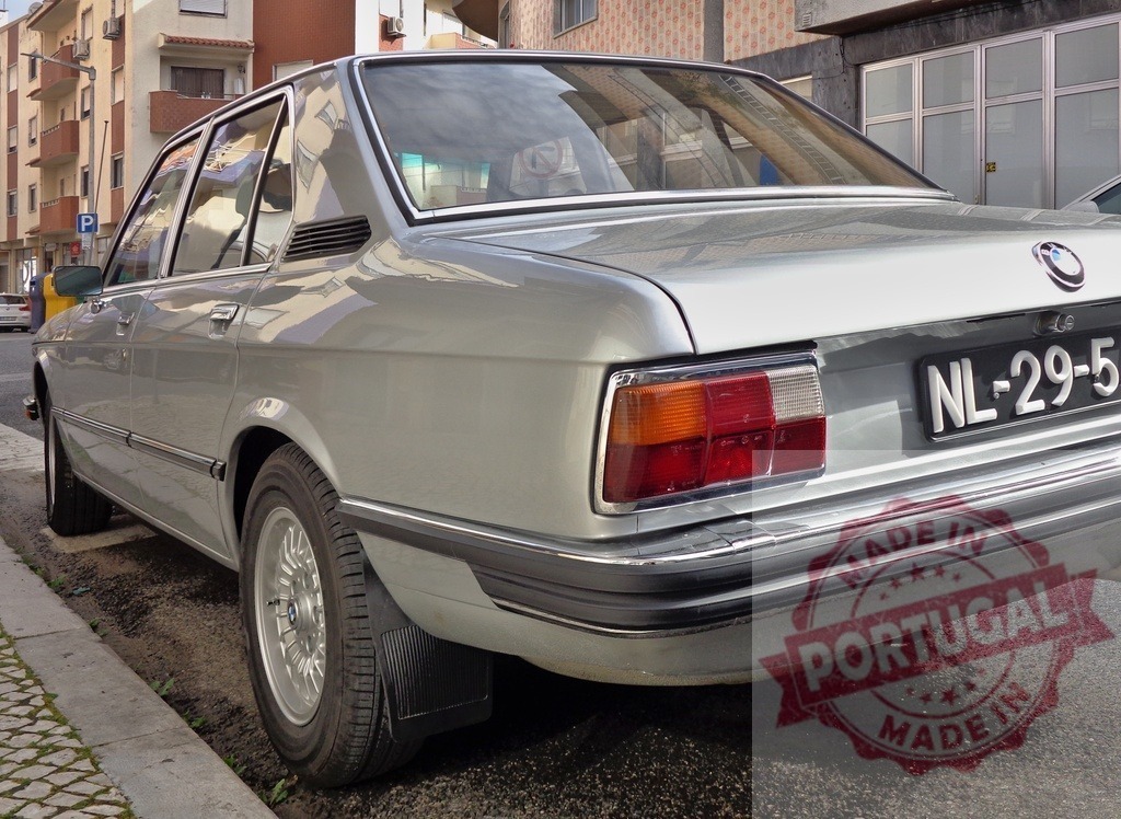 Silver BMW E12 parked on the street in Portugal | Classic BMW E12 car parked on a street in Portugal, showcasing its vintage design - Realisiert mit Pictrs.com