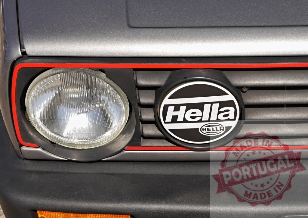 Volkswagen Golf GTI Hella rally automotive detail | Volkswagen Golf GTI front grille closeup with Hella auxiliary light and headlight - Realized with Pictrs.com