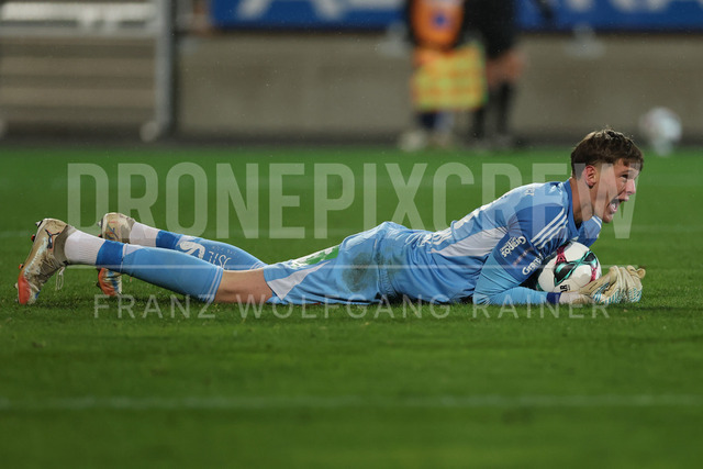 TSV Egger Glas Hartberg vs SV Oberbank Ried – Austrian Bundesliga Match | The image shows Tom Ritzy Huelsmann (Hartberg) with ball and emotions after the win, at the Bundesliga match TSV Hartberg vs SV Ried at Profertil Arena Hartberg. 22.11.2025
