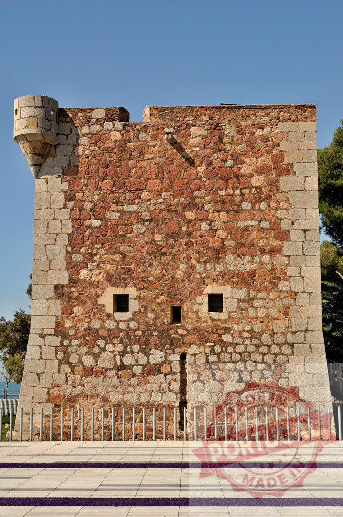 Torre de San Vicente Benicàssim tower seeing a face | Ancient Torre de San Vicente stone tower in Benicàssim, Spain, displaying pareidolia with a face - Realized with Pictrs.com