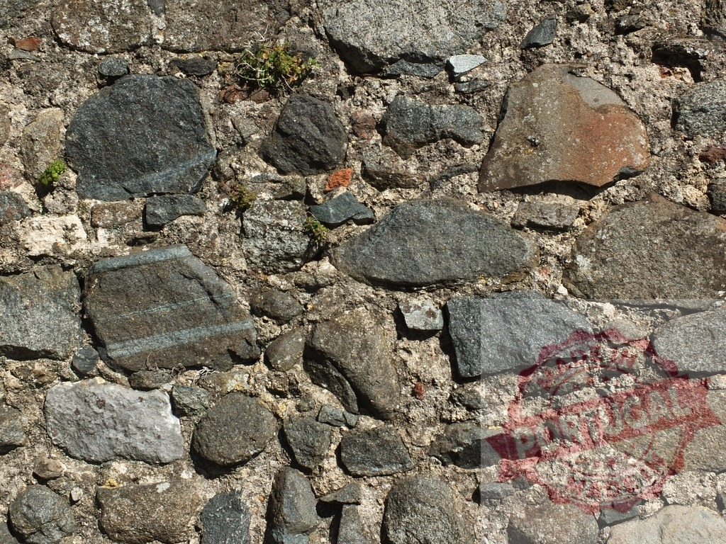 Old stone wall texture rustic background surface | Close up view showing textured surface of an ancient stone wall - Realisiert mit Pictrs.com