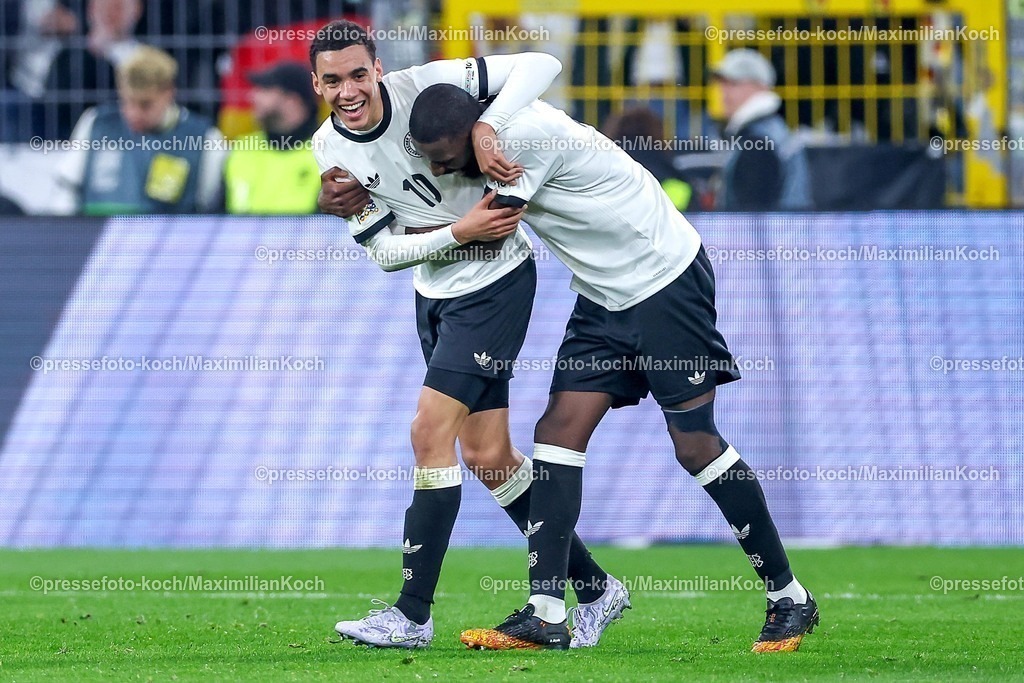 DFB23032501031 | 23.03.2025, Fußball, Viertelfinale UEFA Nations League, Deutschland - Italien, Signal Iduna Park, Saison 2024 2025: Torjubel nach dem Tor zum 2:0 durch Torschütze Jamal Musiala (GER #10) zusammen mit Antonio Rüdiger (GER #02) DFB regulations prohibit any use of photographs as image sequences and or quasi-video.