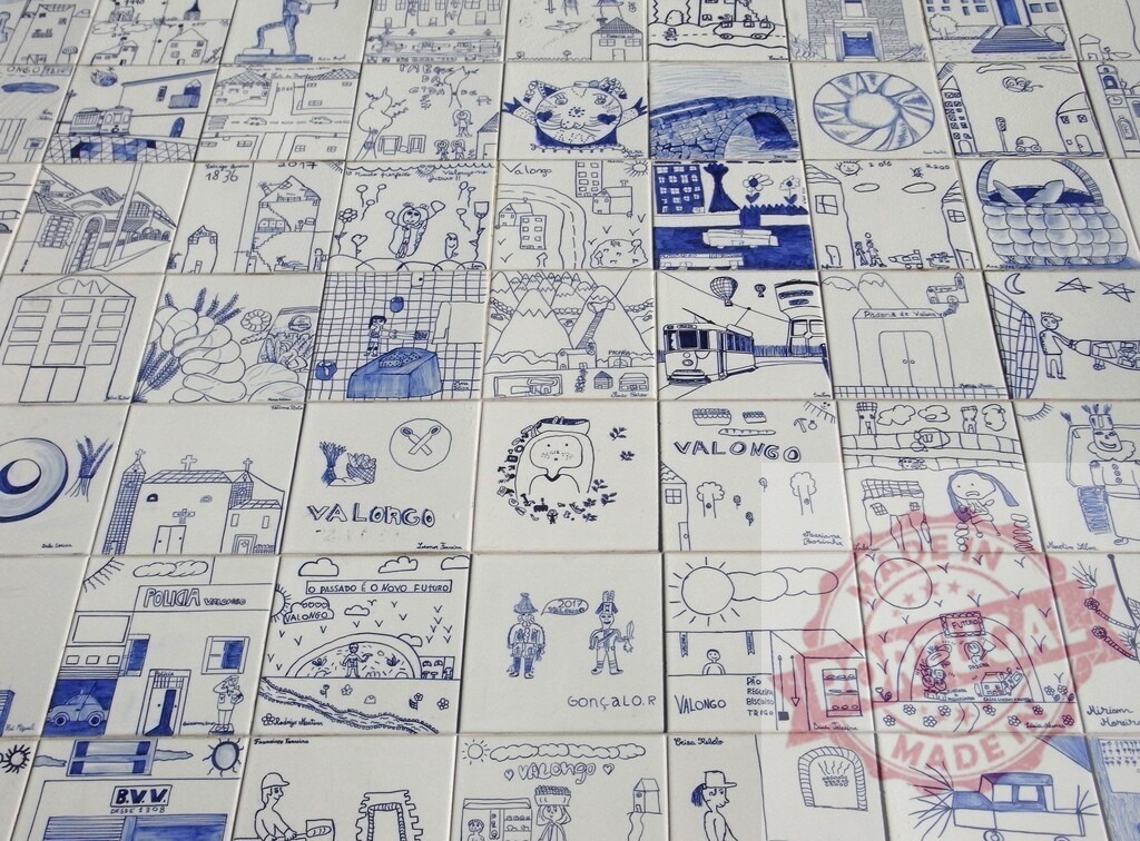 Valongo Portugal azulejos mural depicting local culture | Hand-drawn blue and white tiles forming a mural showcasing Valongo's folk art and identity - Realized with Pictrs.com