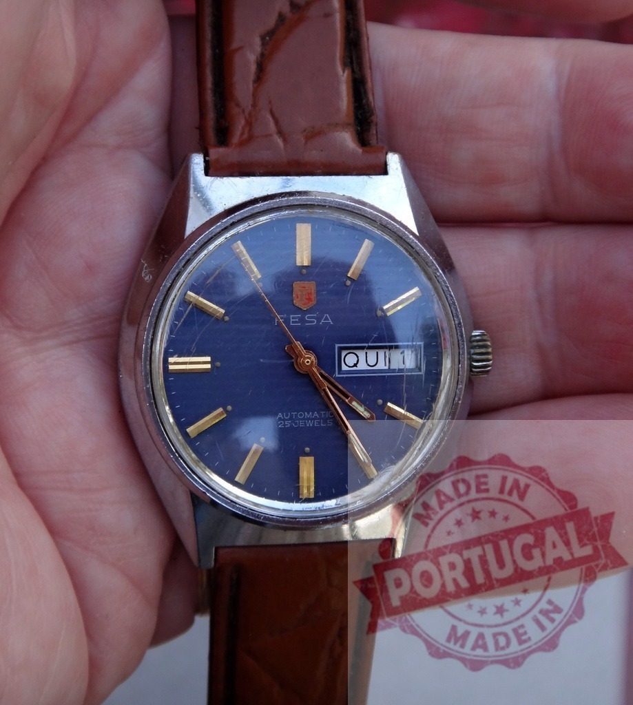 Fesa automatic 25 jewels vintage timepiece with blue dial | Hand holding Fesa automatic watch showing blue dial and brown leather strap - Realized with Pictrs.com