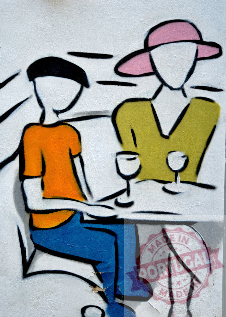 Couple drinking wine at a table in a colorful graffiti painting | Graffiti art depicting two people enjoying wine at a table, showcasing vibrant colors and dynamic lines - Realized with Pictrs.com
