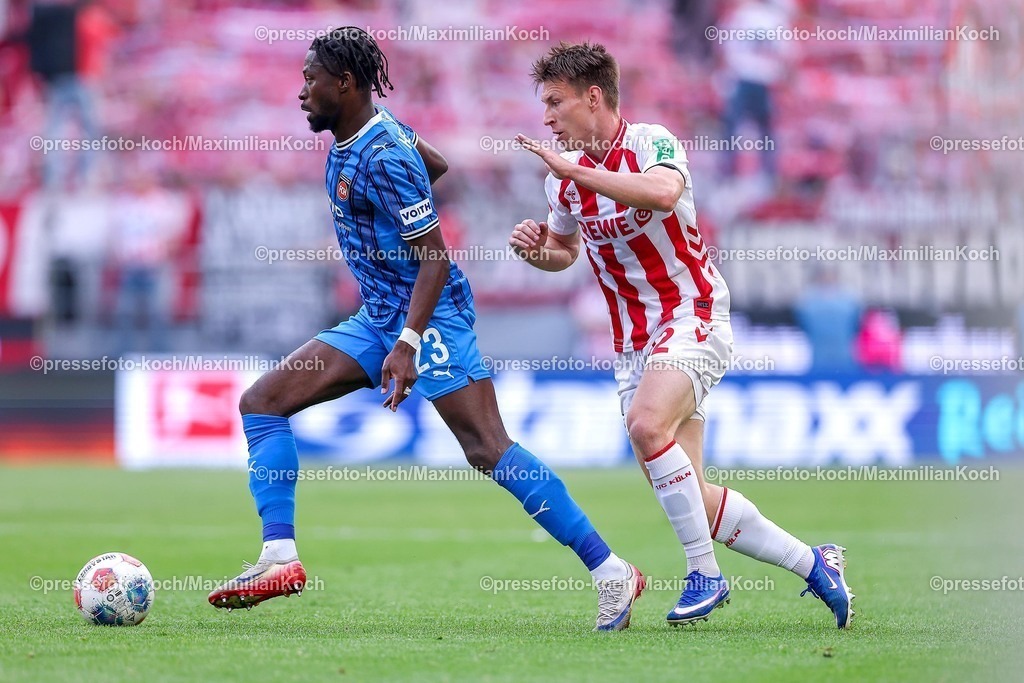 1FC10052601028 | 10.05.2026, Fußball, 1. FC Köln - 1. FC Heidenheim, 1. Fußball Bundesliga Herren, 33. Spieltag, RheinEnergie-STADION, Saison 2025 / 2026: Omar Traore&nbsp; (FC Heidenheim #23) im Zweikampf gegen  Kristoffer Lund&nbsp;(1FC Koeln #32)  DFB regulations prohibit any use of photographs as image sequences and or quasi-video.