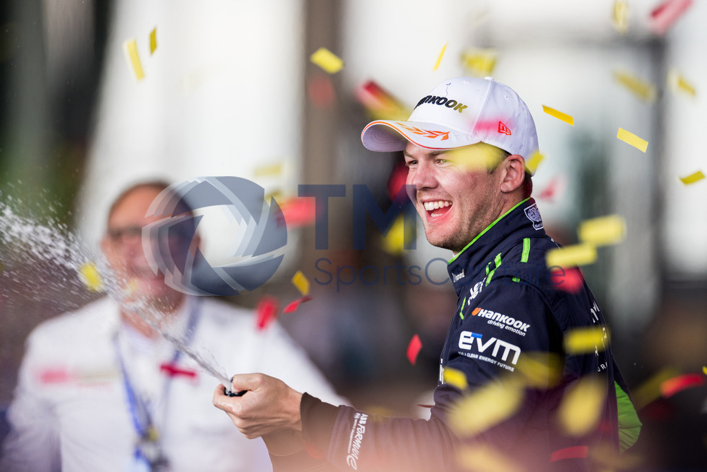 GEPA-20230423-101-147-0238 | Keywords: podium, trophy.  BERLIN,GERMANY,23.APR.23 - MOTORSPORTS, FORMEL E - E-Prix of Berlin, Berliner Tempelhof Airport Circuit. Image shows Nick Cassidy (NZL / Envision). Keywords: podium, champagne shower.   
Photo: GEPA pictures/ Matthias Trinkl