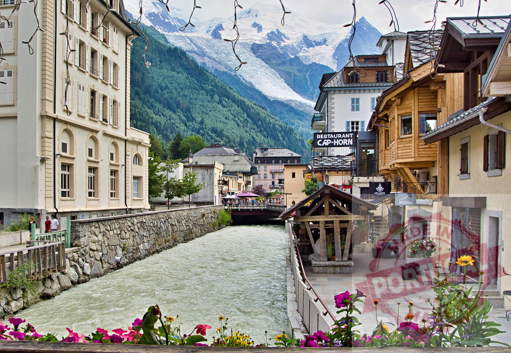 Chamonix village street with Arve river and Mont Blanc | Chamonix village displaying the Arve river flowing through town with the Alps and Mont Blanc glacier - Realized with Pictrs.com