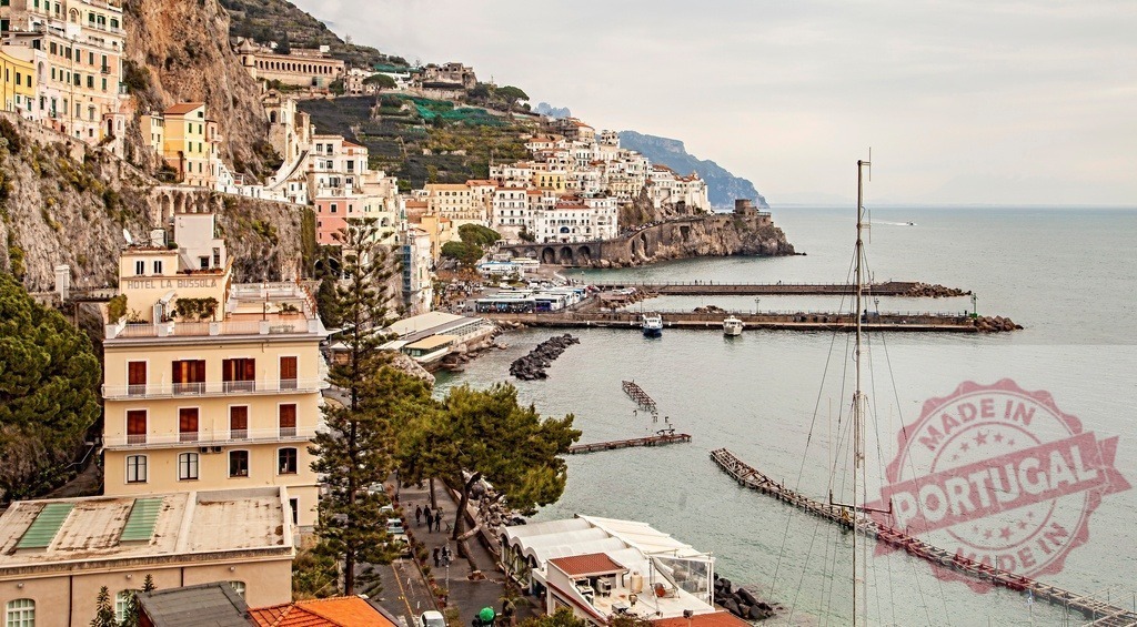 Amalfi Coast village nestled on cliffside overlooking harbor | Amalfi Coast village built into cliffs overlooking the Mediterranean Sea and harbor - Realized with Pictrs.com