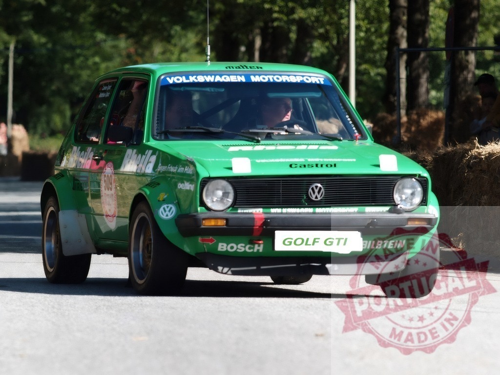 Volkswagen Golf GTI rally racing on rural road | Green classic Volkswagen Golf GTI competing in a hill climb race - Realisiert mit Pictrs.com