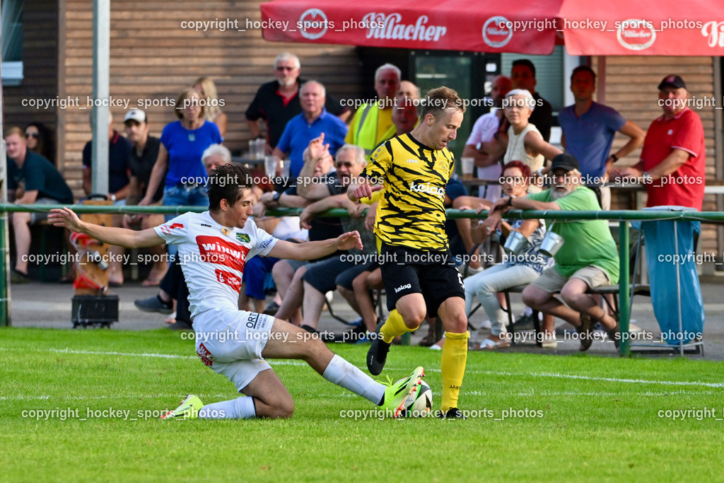 FC Faakersee vs. Rapid Lienz  | #15 Samuel Becciu Rapid Lienz, #23 Roman Adunka FC Faakersee, FC Faakersee vs. Rapid Lienz , FC Faakersee vs. Rapid Lienz  am 04.08.2024 in Faakersee (Sportplatz Faakersee), Austria, (Photo by Bernd Stefan)