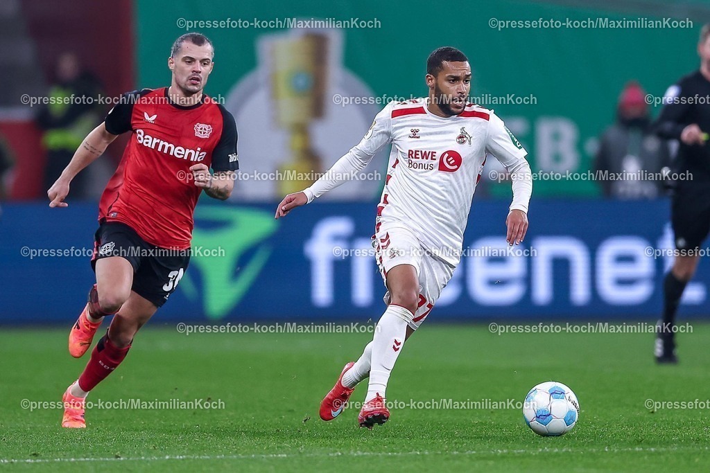 DFB05022501058 | 05.02.2025, Fußball, DFB-Pokal Viertelfinale, Bayer 04 Leverkusen - 1.FC Köln, BayArena, Saison 2024 2025: Granit Xhaka (Bayer04 Leverkusen #34) im Zweikampf gegen Linton Maina (FC Köln #37)DFB regulations prohibit any use of photographs as image sequences and or quasi-video.