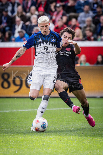 German Bundesliga, Bayer 04 Leverkusen vs. Hamburger SV, 16.05.2026 | LEVERKUSEN, GERMANY - MAY 16, 2026 :  Montrell Amare Culbreath  (Bayer 04 Leverkusen, 42) tackles Albert Gronbaek (Hamburger SV, 23) during the German Bundesliga match on gameday 34 between Bayer 04 Leverkusen vs. Hamburger SV at BayArena on May 16, 2026 in Leverkusen, Germany. DFL REGULATIONS PROHIBIT ANY USE OF PHOTOGRAPHS AS IMAGE SEQUENCES AND/OR QUASI-VIDEO.