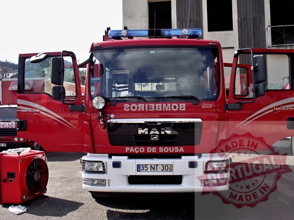 Red emergency fire truck from Paço de Sousa | Red MAN fire truck with doors open, ready for emergency services in Portugal - Realized with Pictrs.com