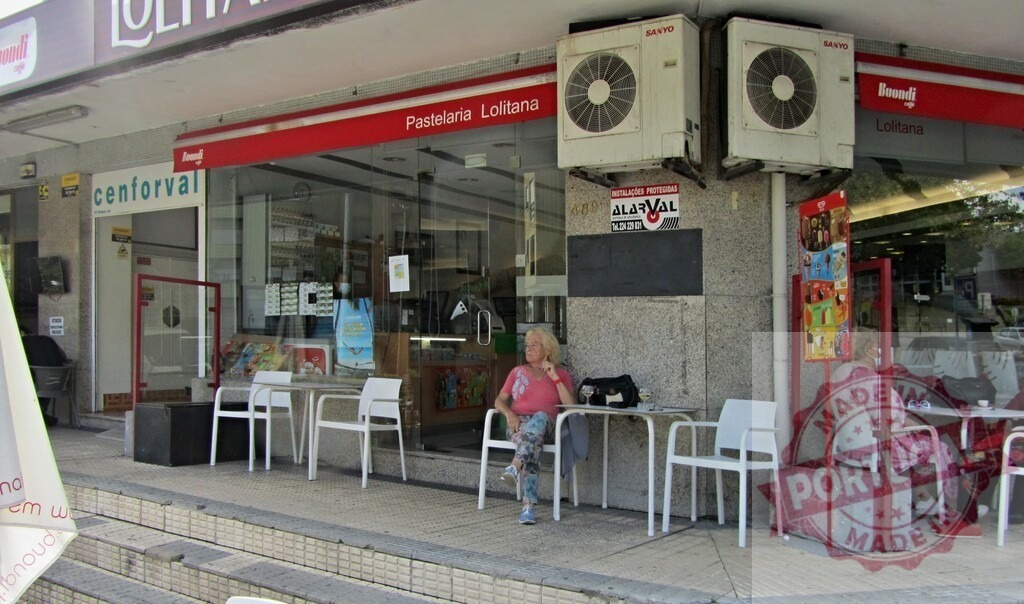 Customers relaxing at cafe outdoor seating area in Loule, Portugal | Pastelaria Lolitana cafe in Loule, Portugal with outdoor seating and customers - Realized with Pictrs.com