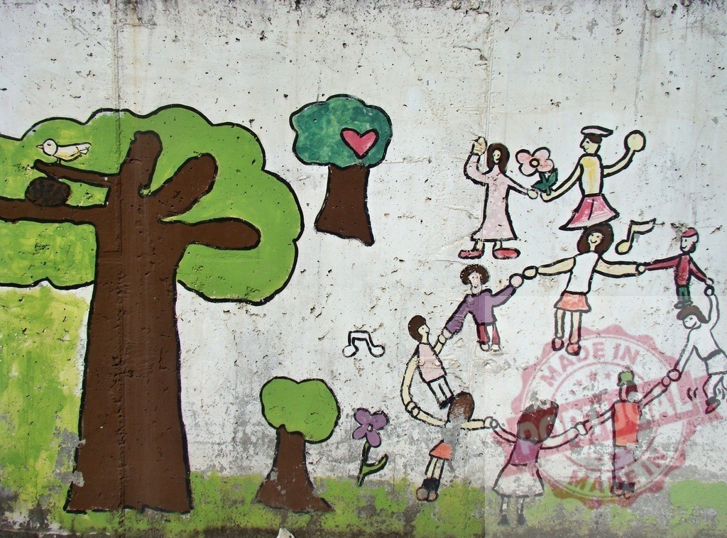 Childlike mural people dancing holding hands unity | Childlike mural showing people dancing in a circle holding hands with trees and nature - Realized with Pictrs.com