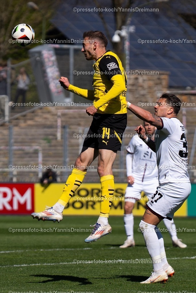 xydr06042501046 | 06.04.2025, xydrx, Fußball, Borussia Dortmund II - FC Ingolstadt 04, 3.Liga, Stadion Rote Erde, Saison 2024 2025: Michael Eberwein (Borussia Dortmund II #14) im Zweikampf gegen Pascal Testroet (FC Ingolstadt #37) DFB regulations prohibit any use of photographs as image sequences and or quasi-video.