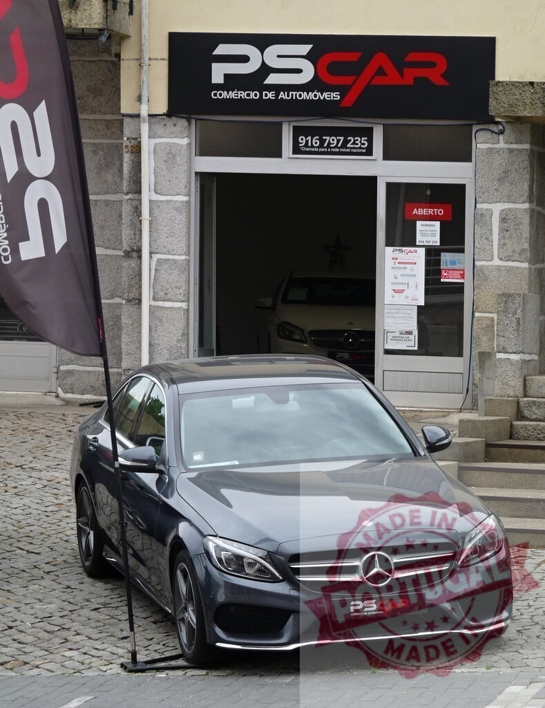 Mercedes-Benz car parked outside PS Car dealership | Grey Mercedes-Benz car displayed outside a Portuguese auto dealership - Realized with Pictrs.com