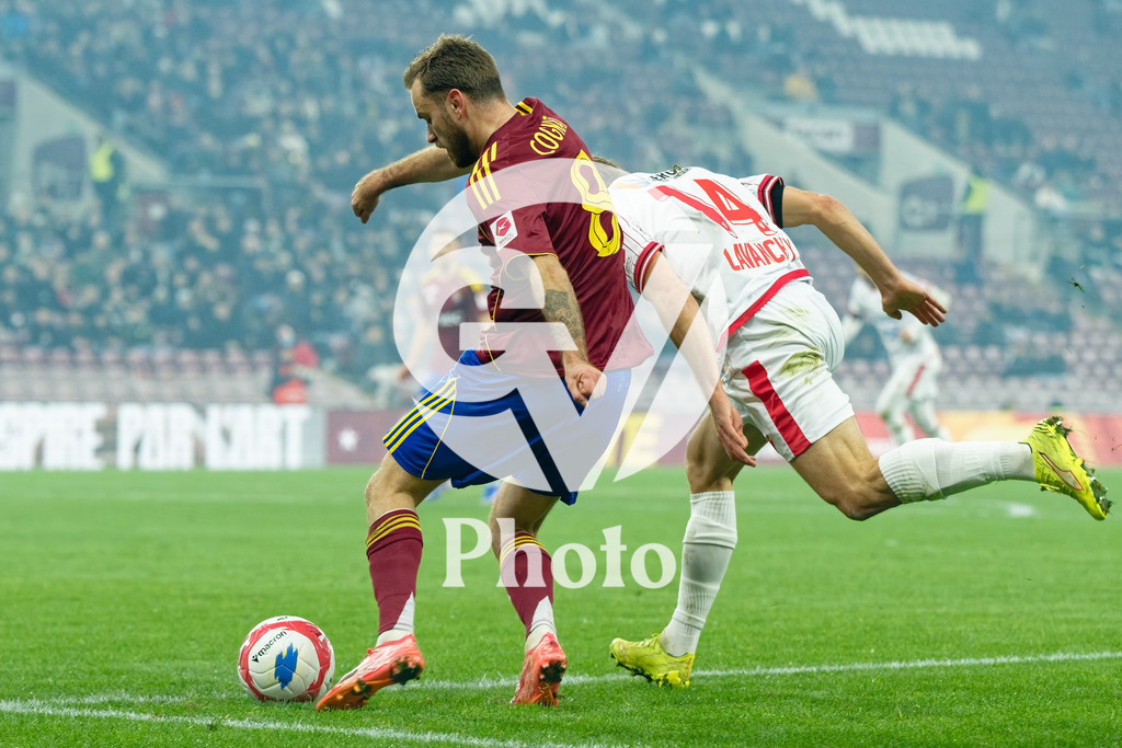 Brack Super League - Servette FC v FC Sion | Timothe Cognat (8 Servette FC) shoots the ball (action) under pressure of Numa Lavanchy (14 FC Sion) during the Brack Super League match between Servette FC and FC Sion at Stade de Geneve in Geneva, Switzerland