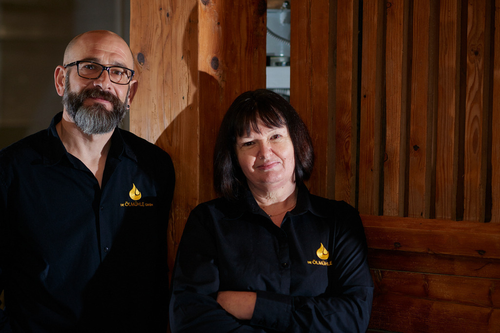 Die Ölmühle | Markt Allhau, Austria - February 09, 2018: Die Ölmühle; Herr Karl Grossschedl und Geschäftsführerin Helga Gradwohl im Raum der Kernölproduktion stehend. - Realisiert mit Pictrs.com