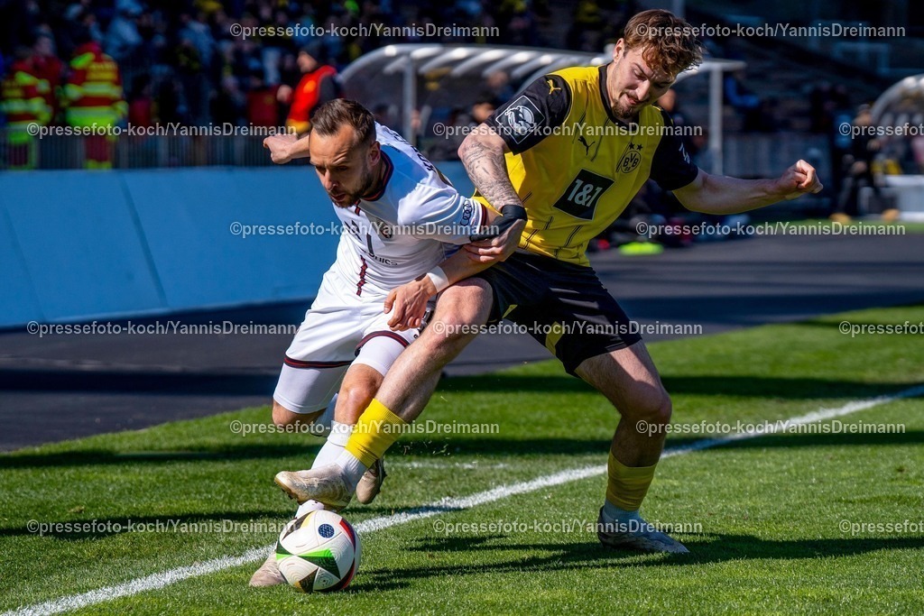 xydr06042501051 | 06.04.2025, xydrx, Fußball, Borussia Dortmund II - FC Ingolstadt 04, 3.Liga, Stadion Rote Erde, Saison 2024 2025: David Kopacz (FC Ingolstadt #29) im Zweikampf gegen Tony Reitz (Borussia Dortmund II #36) DFB regulations prohibit any use of photographs as image sequences and or quasi-video.