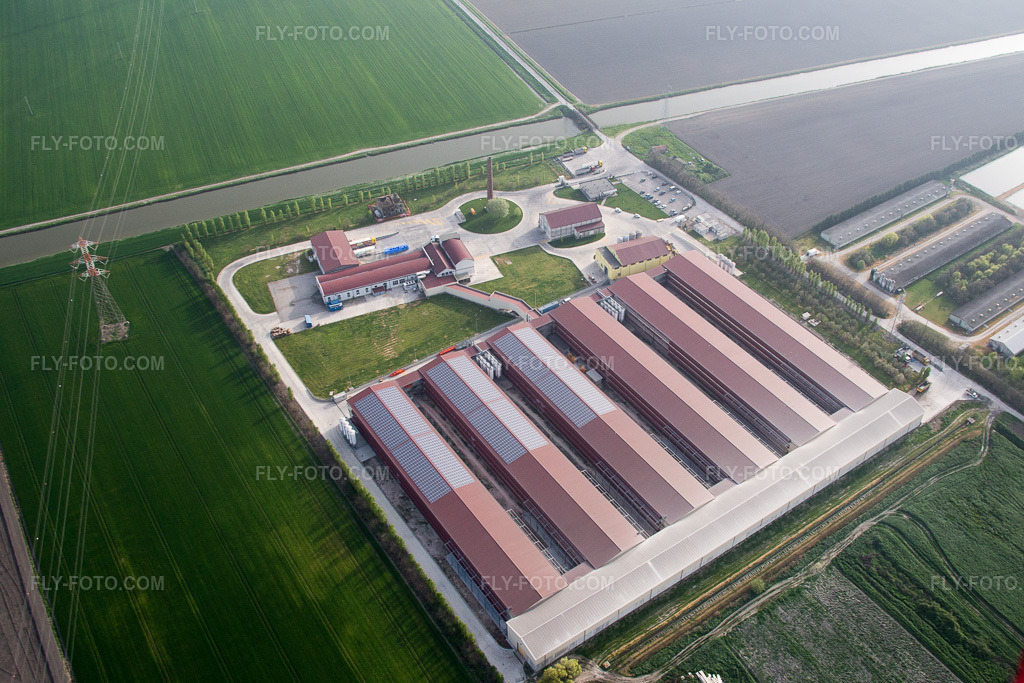 Aerial view: Animal breeding facilities - pig breeding for pork production combined with fish farming ponds in Emilia-Romagna in Codigoro in the state Ferrara, Italy.Photo: IMG_087322.jpg taken on 04/05/2016 by Werner Riehm/FLY-FOTO.comResolution of the original: 4831 x 3221 px