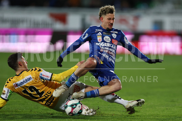 TSV Egger Glas Hartberg vs SV Oberbank Ried – Austrian Bundesliga Match | The image shows Ante Bajic (Ried) make a foul on Damjan Kovacevic (Hartberg), at the Bundesliga match TSV Hartberg vs SV Ried at Profertil Arena Hartberg. 22.11.2025