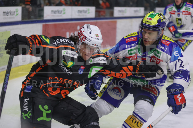 Moser Medical Graz 99ers vs EC iDM Wärmepumpen VSV – Ice Hockey    | Graz, Austria, 27.FEB.26 - ICE HOCKEY - ICE Hockey League, Graz 99ers vs Villacher SV. The image shows Kevin Roy (99ers) and John Hughes (EC VSV).     