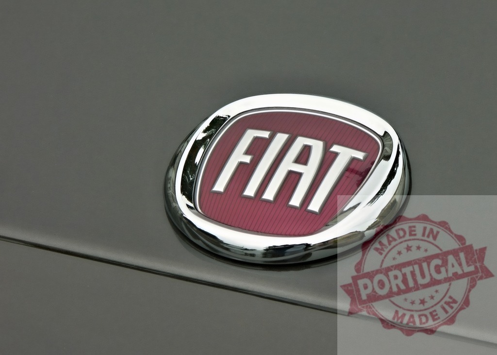 Fiat car brand emblem demonstrating automotive industry | Fiat chrome emblem on a modern car, representing the famous Italian automobile company - Realisiert mit Pictrs.com