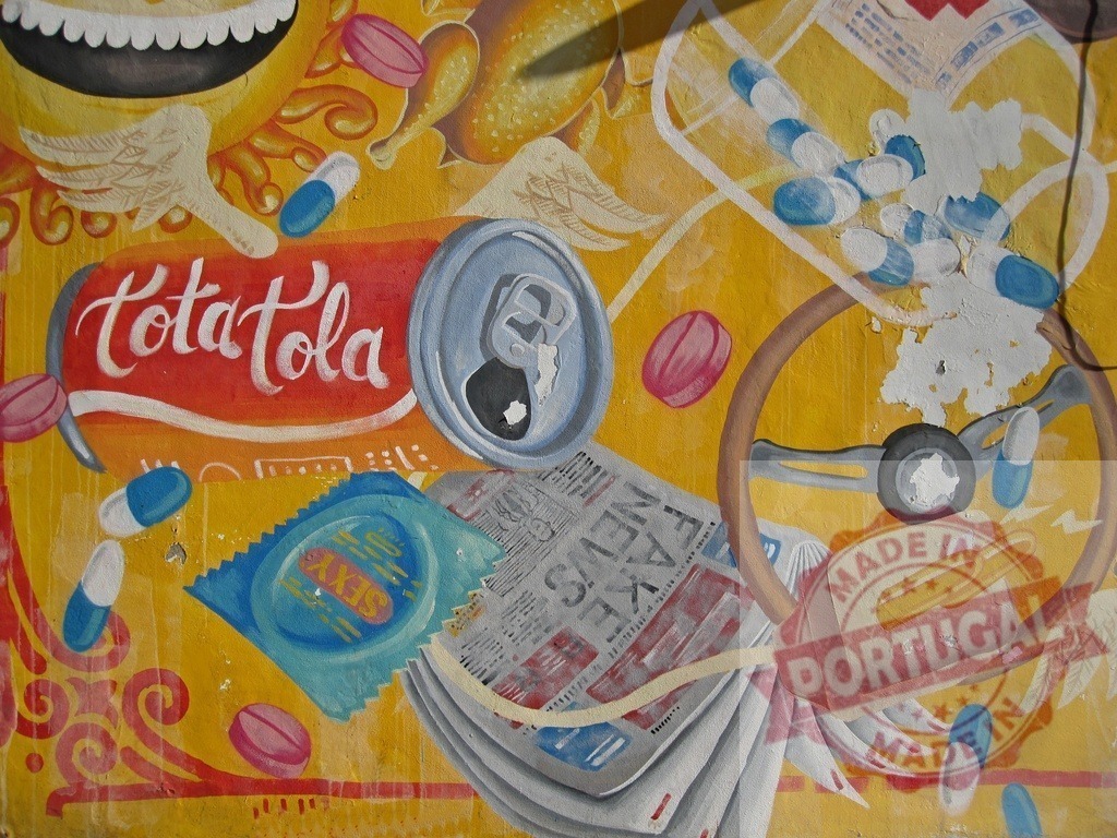 Graffiti art depicting consumerism and addiction with soda can, pills, steering wheel, and condom | Colorful graffiti art explores themes of consumerism, addiction, and modern society, featuring various symbolic objects - Realisiert mit Pictrs.com