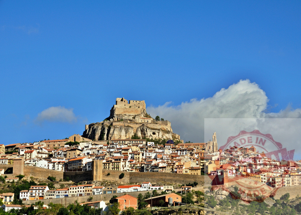 Morella medieval Spanish village with historic castle and walls. Spain - Castellon | Morella village displaying a historic castle overlooking stone buildings and ancient city walls - Realized with Pictrs.com