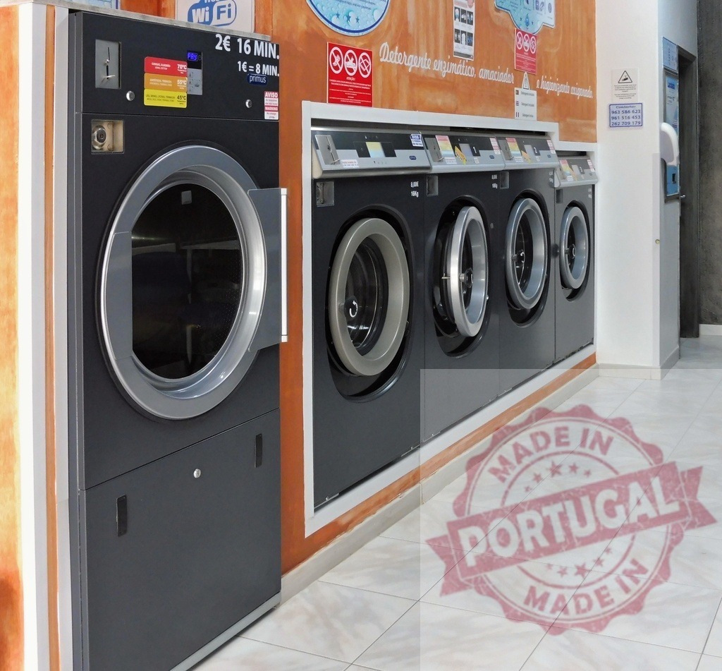 Self-service laundromat washing machines providing hygiene and clean laundry | Laundromat washing machines arranged in a row ready for commercial self-service laundry - Realized with Pictrs.com
