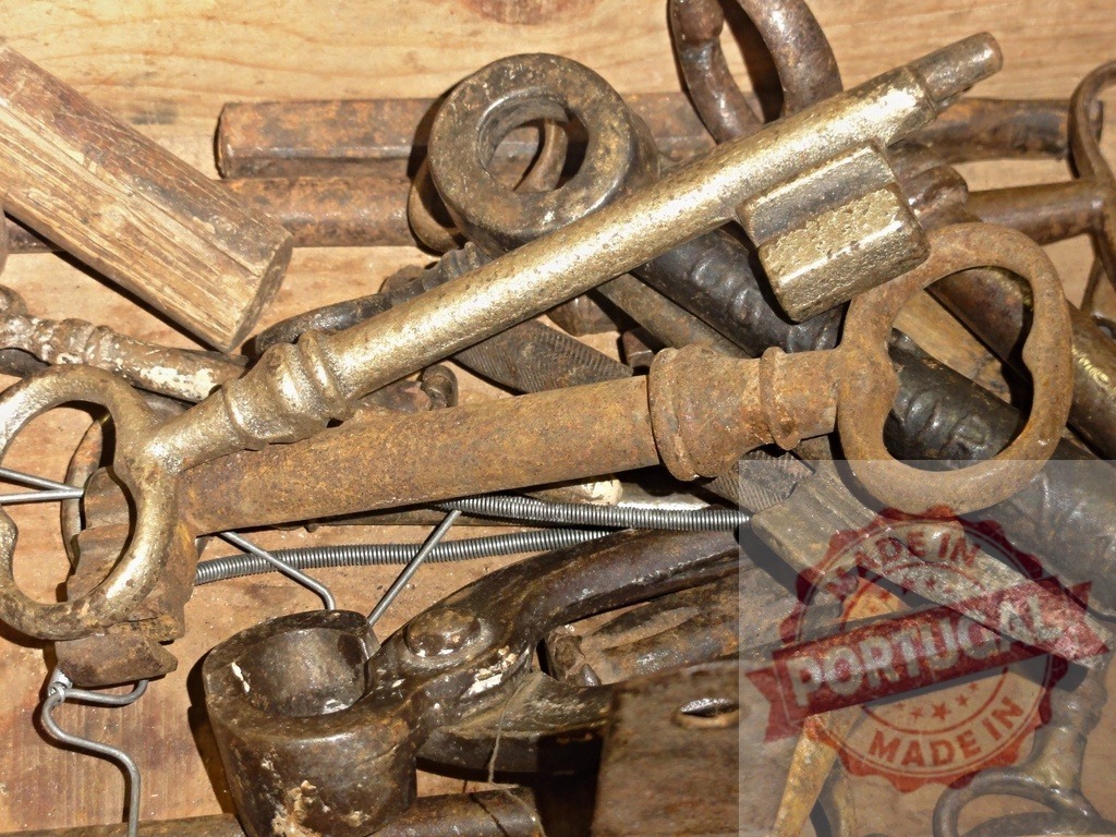 Collecting antique skeleton keys for opening old locks | Pile of various old metal skeleton keys with rust and aged patina - Realized with Pictrs.com