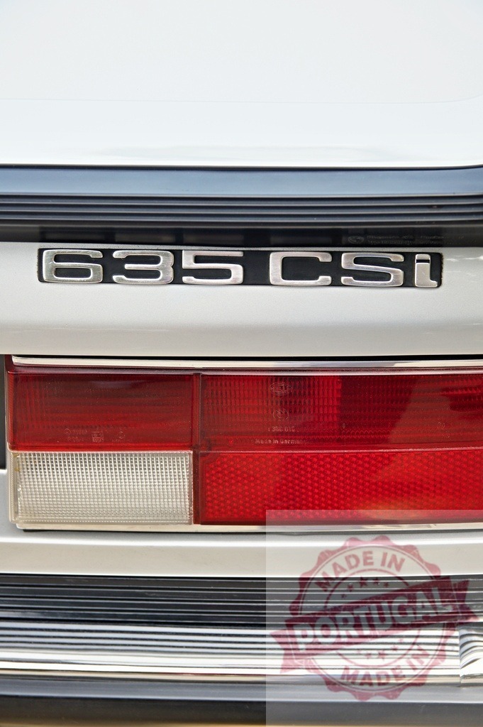 BMW 635 CSi E24 classic car rear view | BMW 635 CSi E24 classic car rear trunk showing model badge and taillight - Realized with Pictrs.com