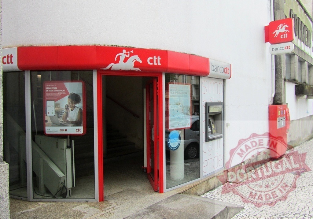 CTT Banco CTT branch building in Portugal | CTT Banco CTT branch facility providing postal and banking services - Realized with Pictrs.com