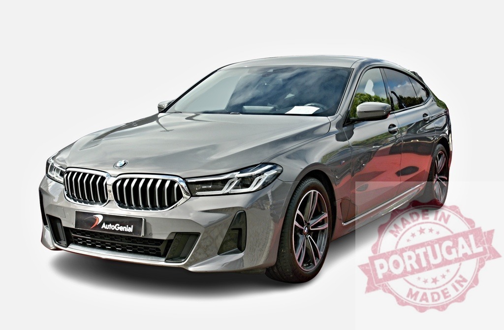 BMW 6 series gran turismo posing on white background | Modern gray BMW 6 series gran turismo posing on white background - Realized with Pictrs.com