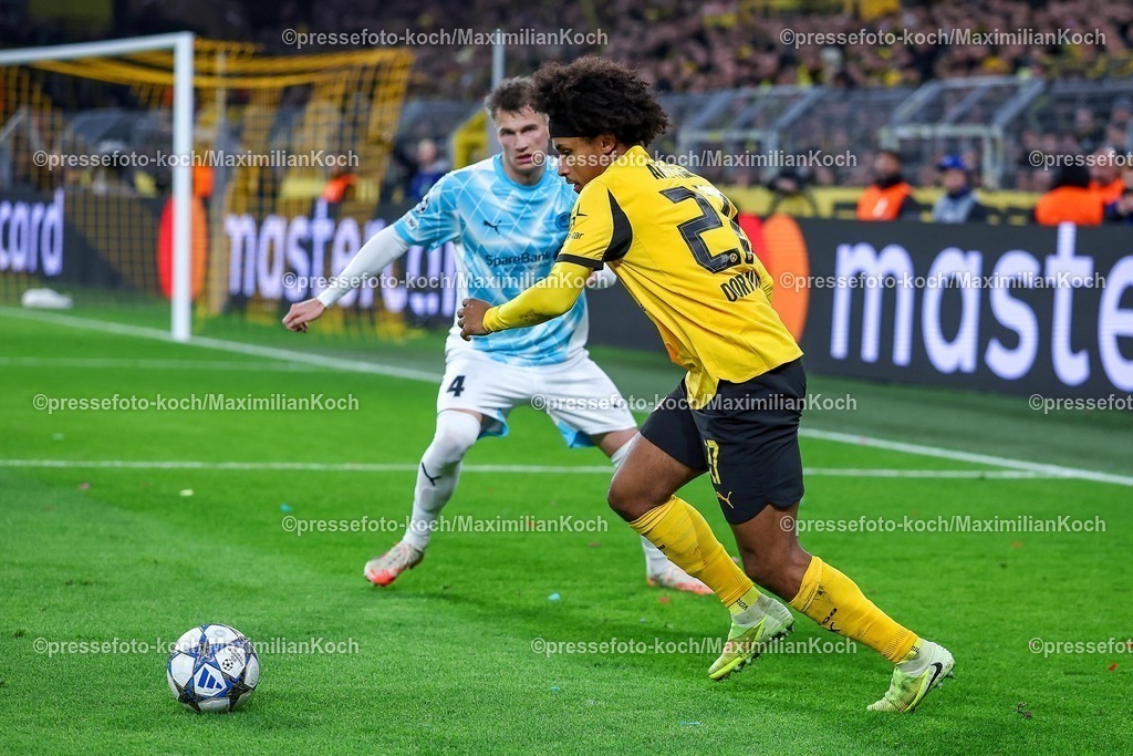 UCL10122501080 | 10.12.2025, Fußball, UEFA Champions League, Borussia Dortmund - FK Bodö/Glimt, BVB Stadion, 5. Spieltag, Saison 2025 2026: Odin Bjortuft (Bodo Glimt #04) im Zweikampf gegen  Karim Adeyemi (BVB #27)  Regulations prohibit any use of photographs as image sequences and or quasi-video.