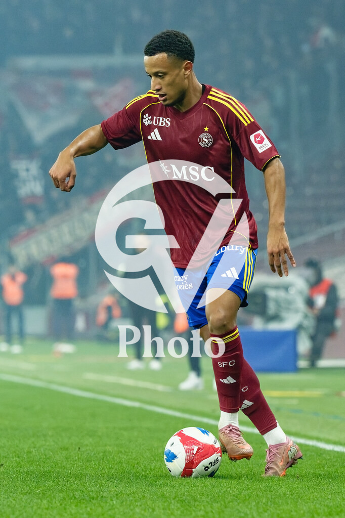 Brack Super League - Servette FC v FC Sion | Lilian Njoh (14 Servette FC) controls the ball (action)  during the Brack Super League match between Servette FC and FC Sion at Stade de Geneve in Geneva, Switzerland