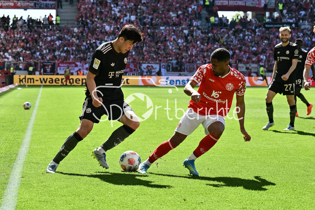 1. FSV Mainz 05 - FC Bayern München | MAINZ, GERMANY - 25. APRIL: im Duell Minjae KIM (FC Bayern Munich 3) und Phillipp MWENE (1. FSV Mainz 05 2) während dem Bundesligamatch zwischen dem 1. FSV Mainz 05 und dem FC Bayern München am 31. Spieltag in der MEWA Arena / DFL REGULATIONS PROHIBIT ANY USE OF PHOTOGRAPHS AS IMAGE SEQUENCES AND/OR QUASI-VIDEO