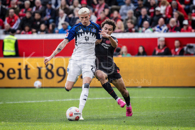 German Bundesliga, Bayer 04 Leverkusen vs. Hamburger SV, 16.05.2026 | LEVERKUSEN, GERMANY - MAY 16, 2026 :  Montrell Amare Culbreath  (Bayer 04 Leverkusen, 42) tackles Albert Gronbaek (Hamburger SV, 23) during the German Bundesliga match on gameday 34 between Bayer 04 Leverkusen vs. Hamburger SV at BayArena on May 16, 2026 in Leverkusen, Germany. DFL REGULATIONS PROHIBIT ANY USE OF PHOTOGRAPHS AS IMAGE SEQUENCES AND/OR QUASI-VIDEO.