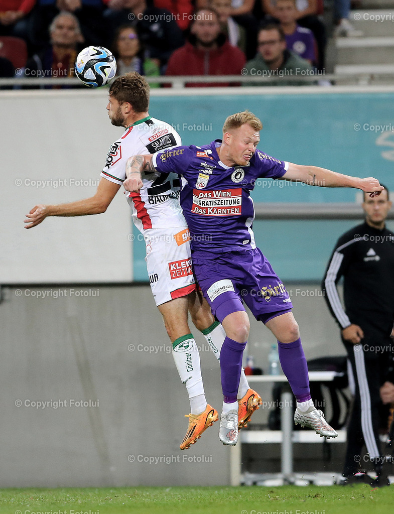 A_LUI_090823_12 | SPORT,FUSSBALL,ADMIRAL BUNDESLIGA AUSTRIA KLAGENFURT 09.08.2023 IM BILD:JONAS ARWEILER  (KLAGENFURT) UND DOMINIK BAUMGARTNER  (WAC) FOTO:FOTOLUI/MW