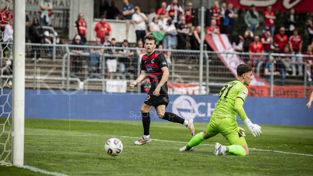Viktoria Koeln vs. SV Wehen Wiesbaden, 11.04.2026 | KOELN, GERMANY - APRIL 11, 2026:  Lucas Wolf (Viktoria Köln, 21, on the left) scoring his team's second goal during the 3rd division match between Viktoria Koeln vs. SV Wehen Wiesbaden at the Sportpark Hoehenberg on matchday 7 on April 11, 2026 in Koeln, Germany. DFL REGULATIONS PROHIBIT ANY USE OF PHOTOGRAPHS AS IMAGE SEQUENCES AND/OR QUASI-VIDEO.