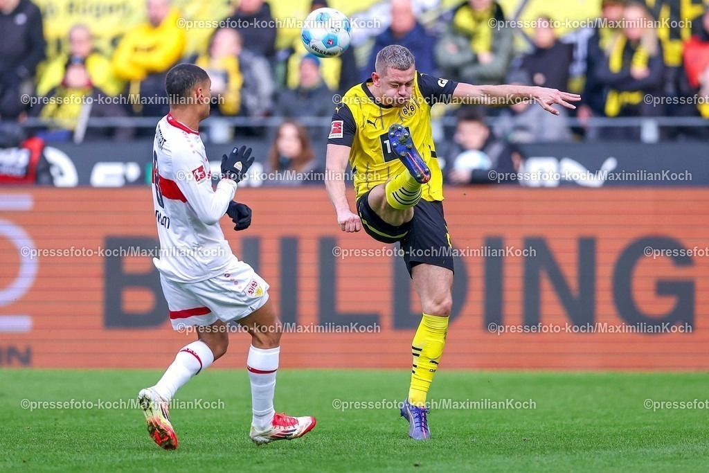 BVB08022501023 | 08.02.2025, Fußball, Borussia Dortmund - VfB Stuttgart, 1. Fußball Bundesliga, 21. Spieltag, Signal Iduna Park, Saison 2024 2025: Enzo Millot (VfB Stuttgart #8) im Zweikampf gegen Julian Ryerson (BVB #26)DFB regulations prohibit any use of photographs as image sequences and or quasi-video.