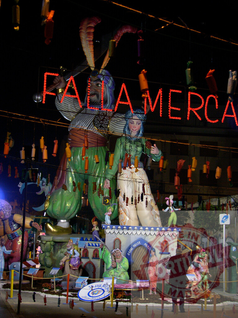 Falla Mercado monument with ninots during Las Fallas festival. Fallas Fiestas Communidad Valenciana | Falla Mercado monument featuring large ninots and fireworks by night at Las Fallas - Realisiert mit Pictrs.com