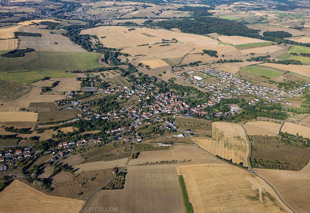 Aerial view: View of the town from the east in Gros-Réderching in the state Moselle, France. – Photo: IMG_158584.jpg taken on 08/14/2026 by Werner Riehm/FLY-FOTO.com – Resolution of the original: 5811 x 4000 px