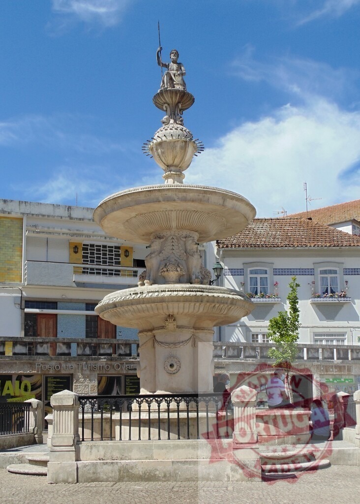 Aveiro Region - Portugal Neptune fountain architecture in Ovar, Portugal town square | Historic Neptune fountain landmark with stone sculpture and classical details on a sunny day - Realized with Pictrs.com